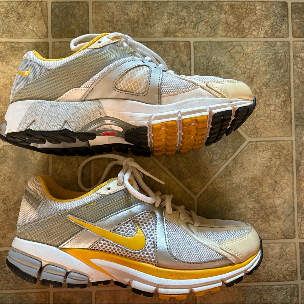 Nike White and Yellow Athletic Shoes with Mesh Upper.  Smoke free home.